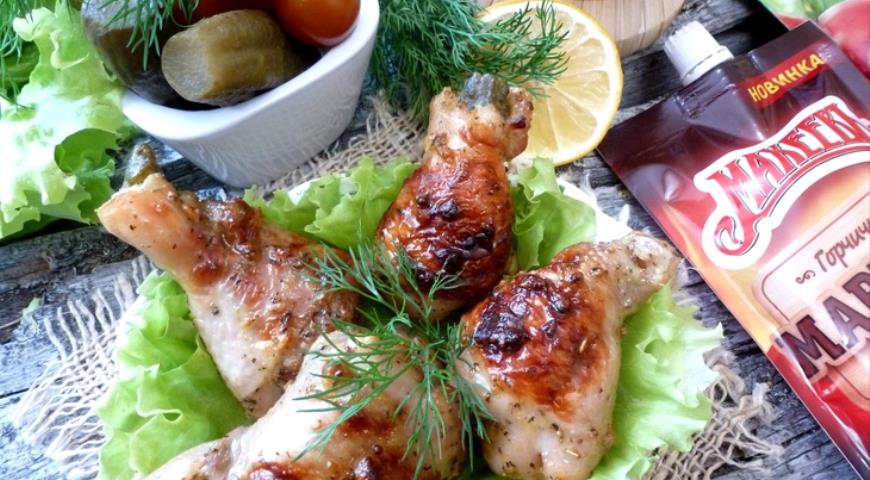 Baked chicken legs stuffed with pickled cucumber