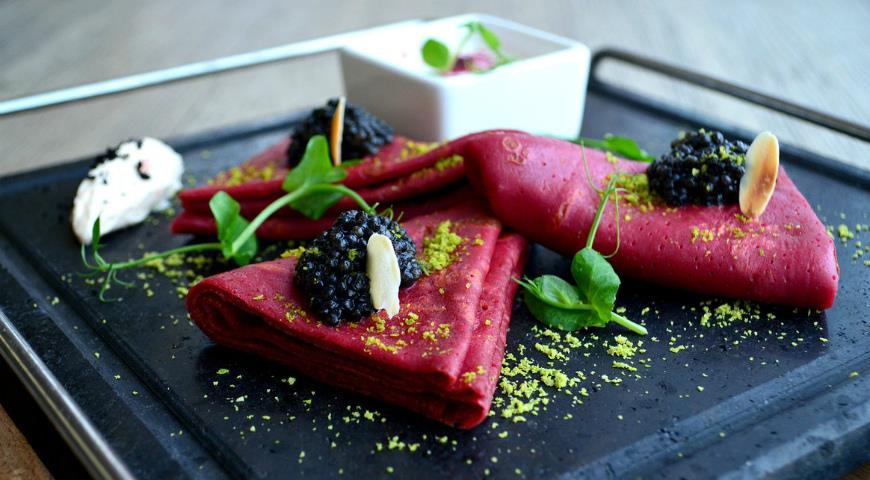 Beetroot pancakes with black caviar and sour cream