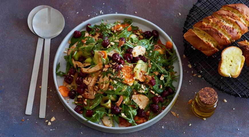 Large salad with grilled chicken, vegetables and pickled cherries