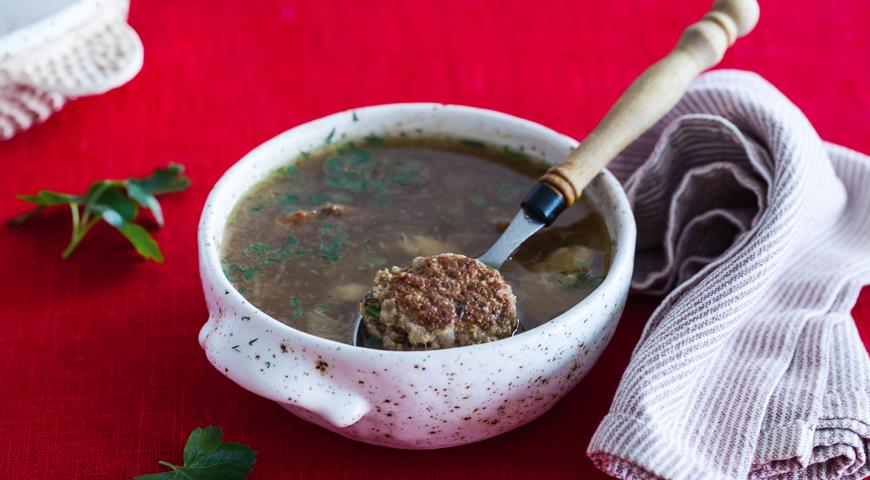 Meat broth with porcini mushrooms and turkey meatballs