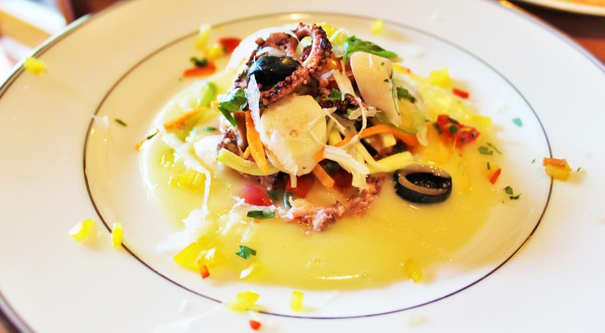 Octopus salad with potato cream soup and white celery