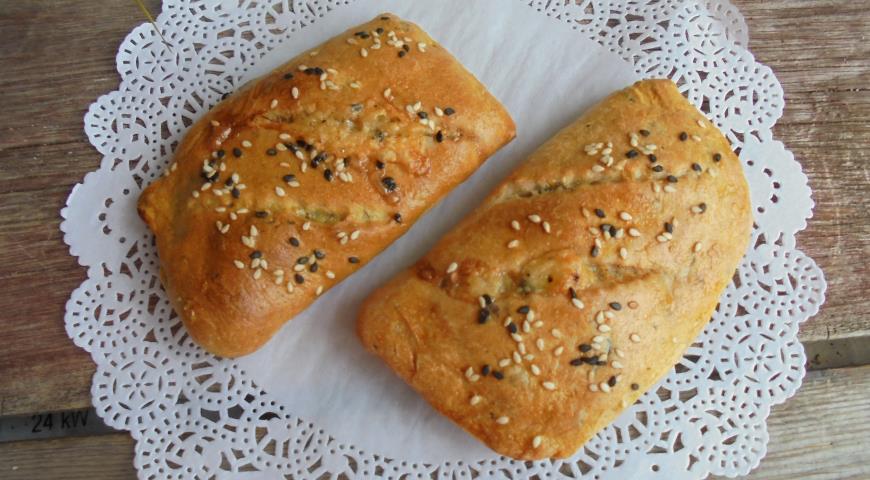 Snack pies with cheese on dough with seaweed