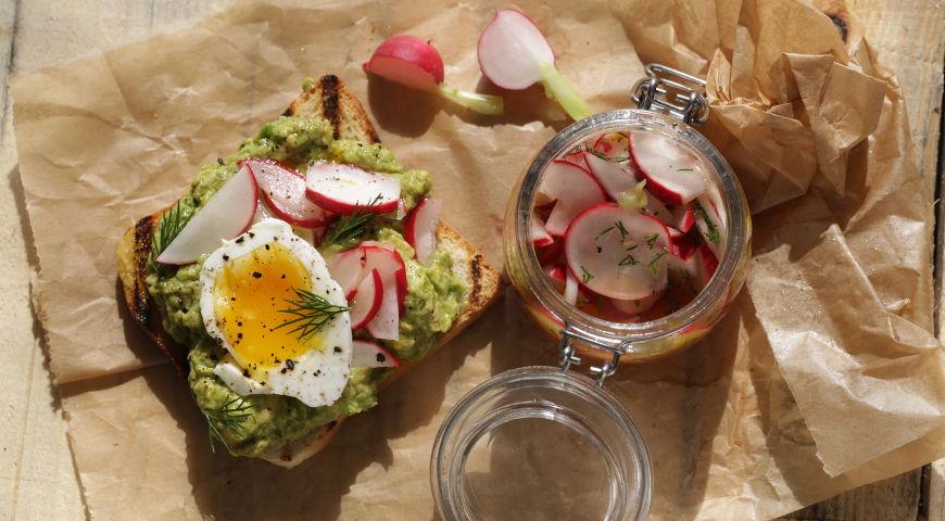 Toast with pickled radish, avocado and bagged eggs