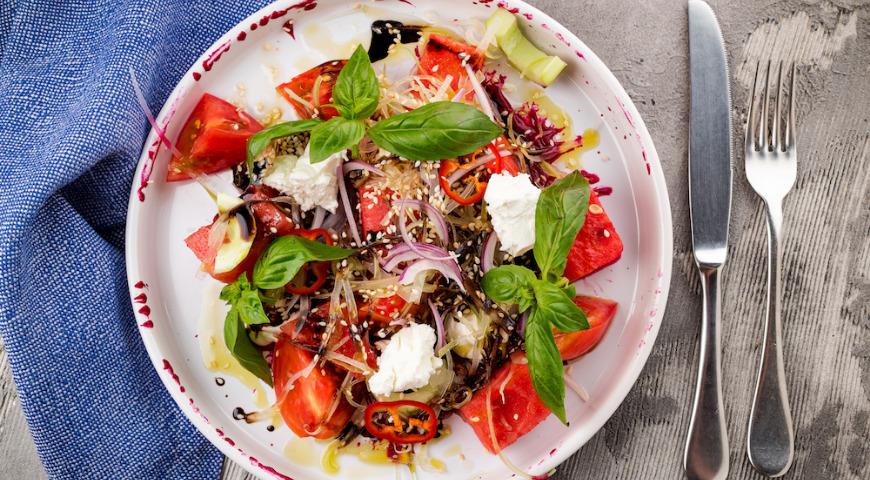 Watermelon salad with feta cheese and tomatoes